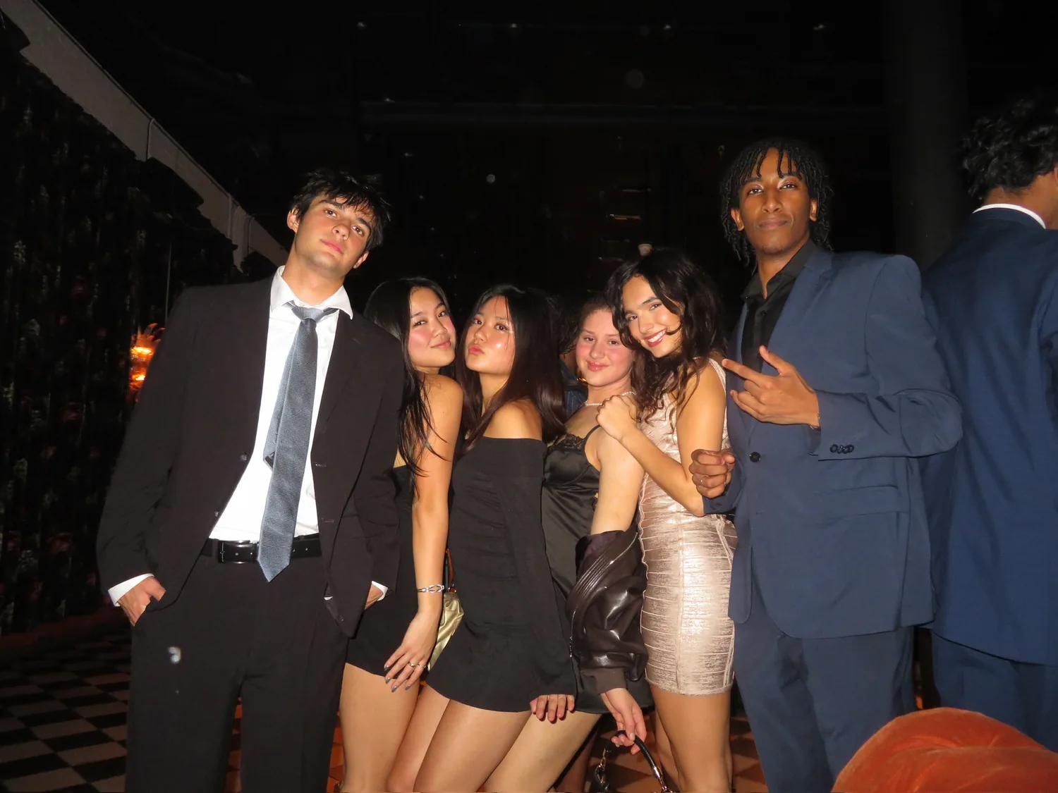 Brothers in suits and dresses at formal