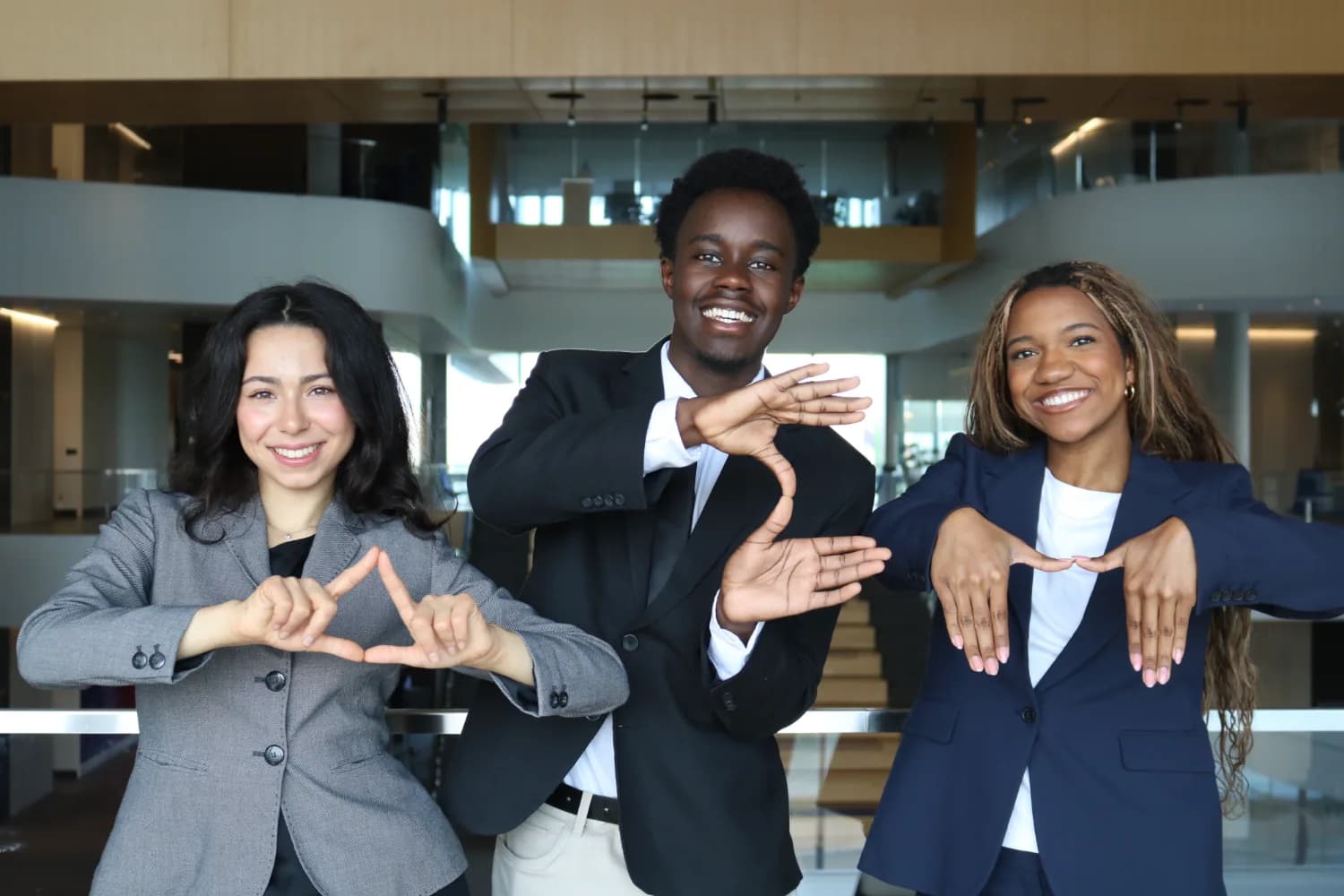Brothers making the ΔΣΠ hand sign