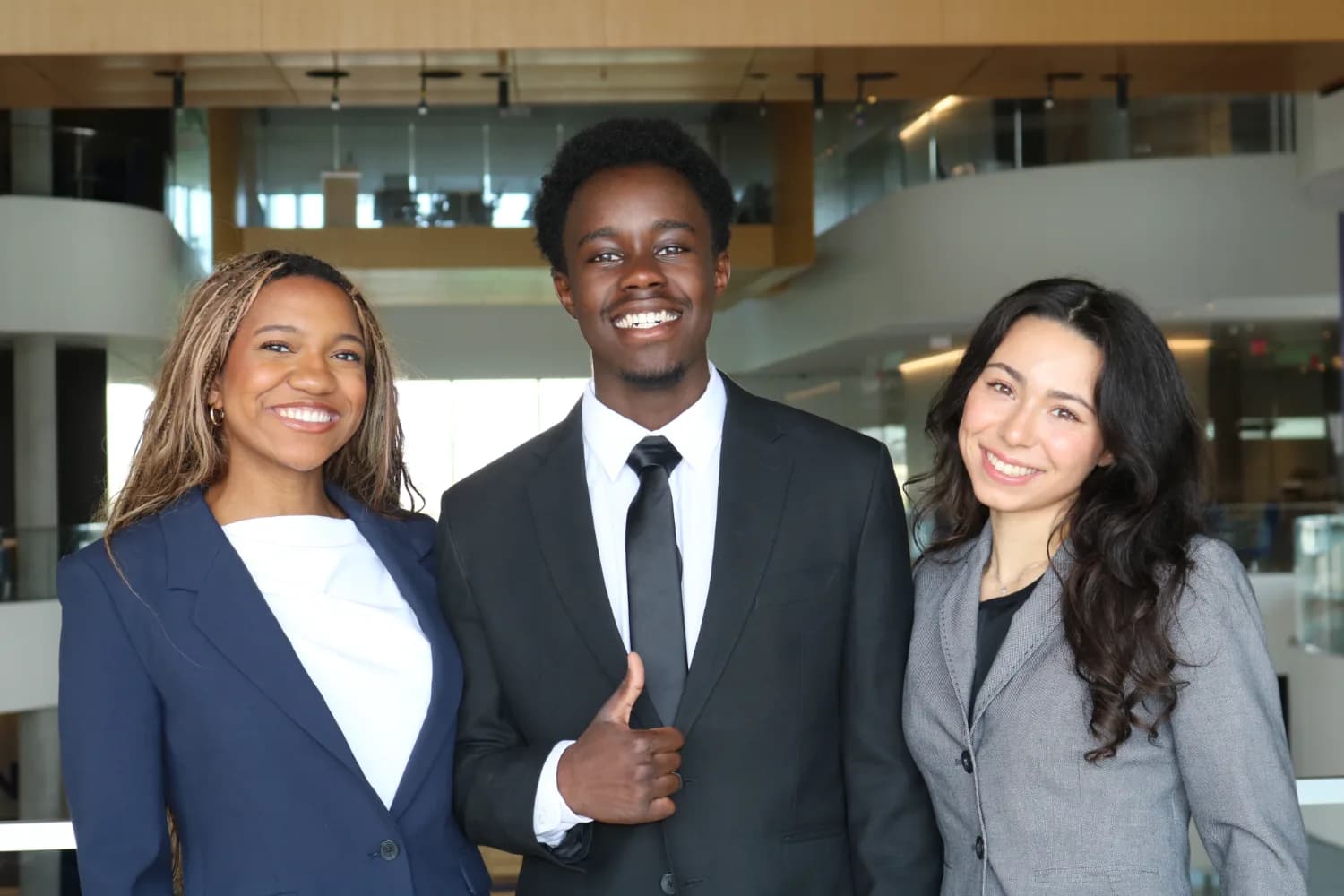 Three brothers in suits at the Global Hub